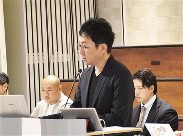 株主からの質問に応じる林社長